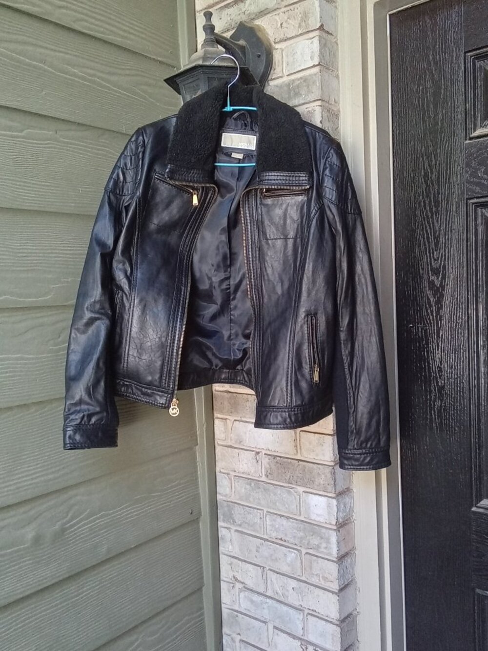 Michael Kors women's leather jacket in size M features a stylish sherpa collar
